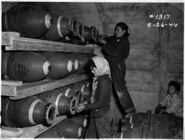 Photo of Navajo women stack munitions